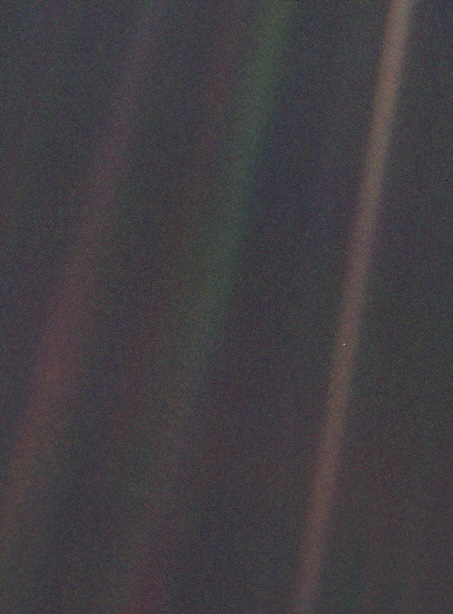 Three faint bands of light against a black background. A tiny blue dot is visible halfway up the band to the right.